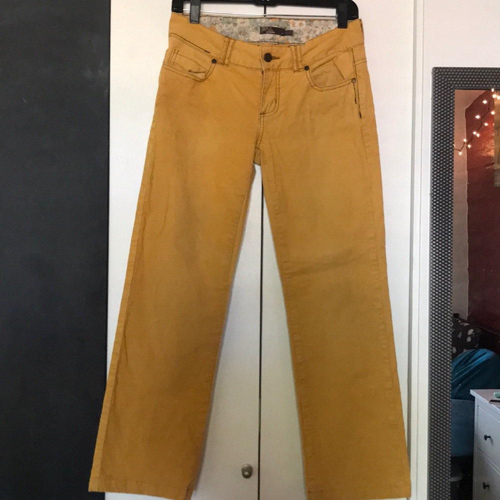 Yellow corduroy pants.